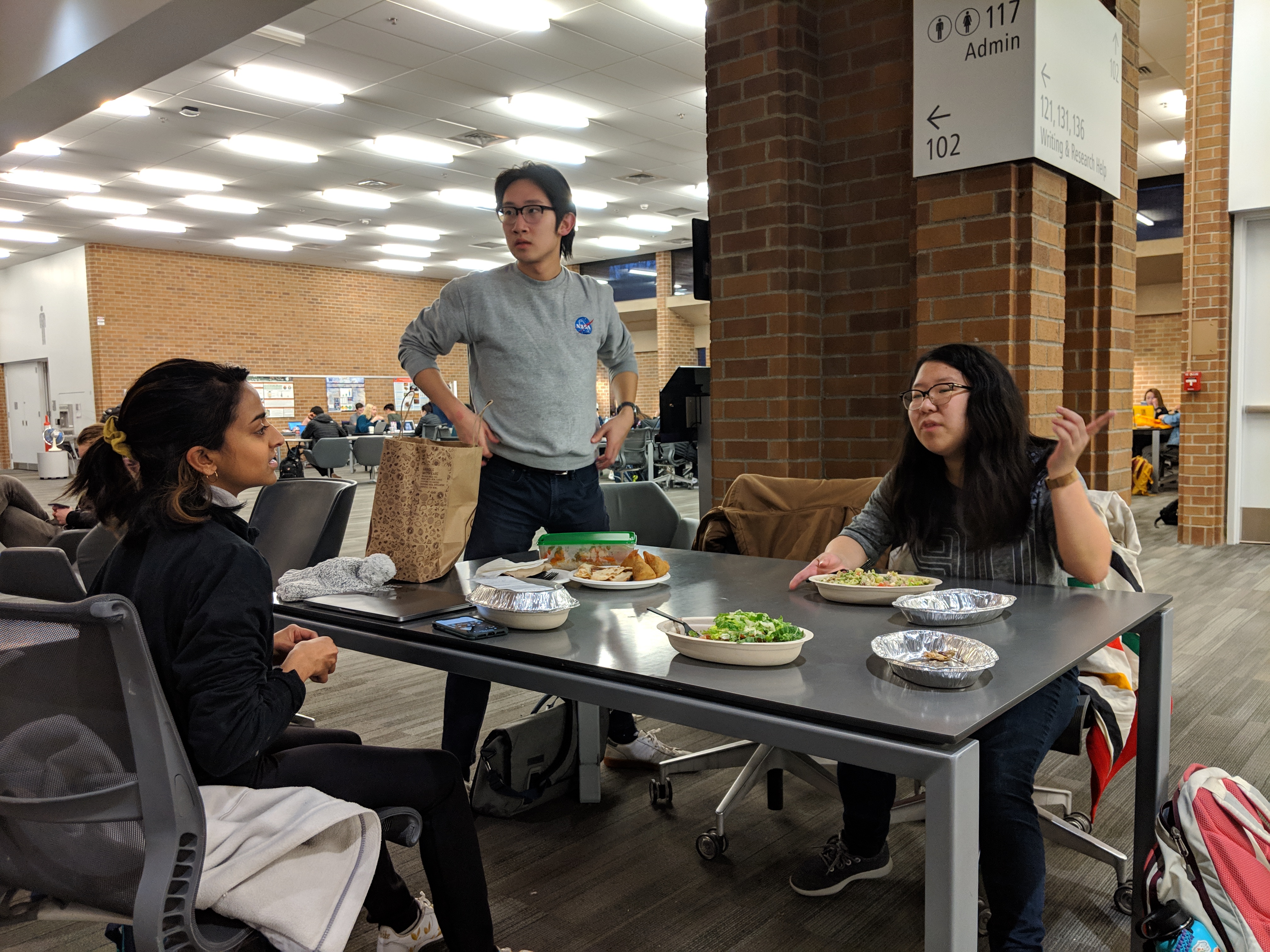 Vishaka and Annie eat Chipotle while Alex power-poses.