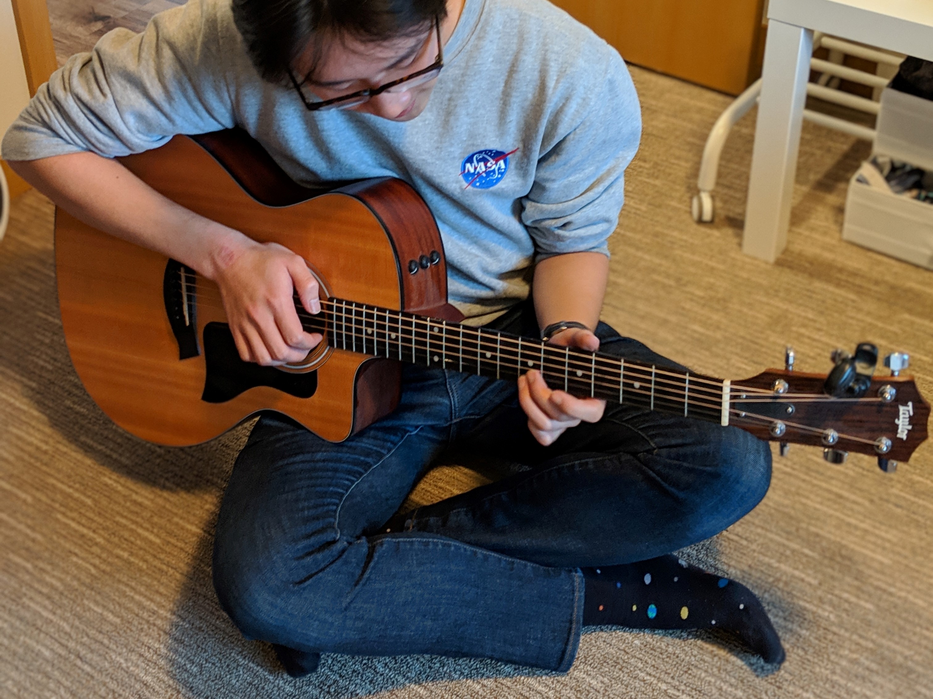 Alex playing the guitar