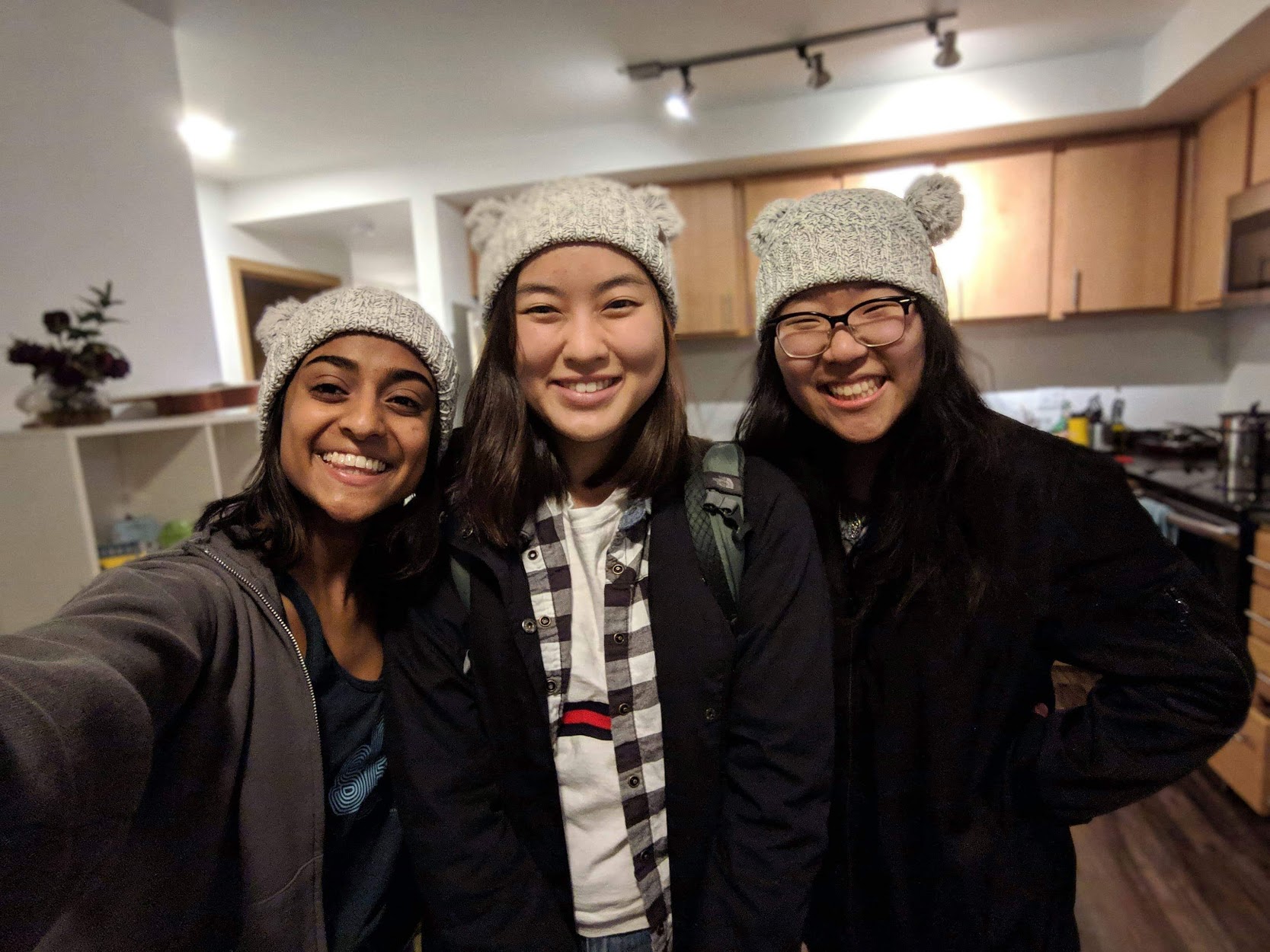 Vishaka, Alli, and Annie wearing matching hats. (Power move over Vishaka.)